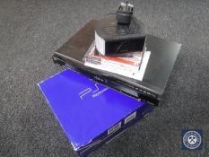 A Panasonic DVD recorder (no lead) together with a boxed Sony PlayStation 2 with three games and