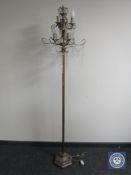 A contemporary metal standard lamp