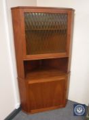 A mid twentieth century teak corner cabinet