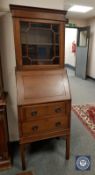 An Edwardian mahogany bureau bookcase of small proportions,