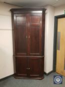 A Georgian mahogany corner cabinet,