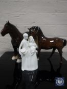 A Royal Doulton horse, front leg raised in brown gloss finish,