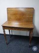 A Victorian mahogany turn over top tea table
