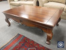 A contemporary universal coffee table with metal mounts