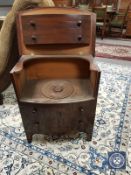 A 19th century mahogany bowfront step commode,