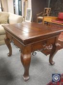 A contemporary universal lamp table with metal mounts