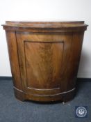 A late nineteenth century continental mahogany corner cabinet