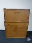 A late twentieth century teak bureau