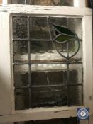 Four framed stained glass leaded windows