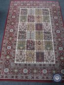 A machine made Persian style rug on red ground