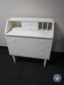 A twentieth century teak painted bureau