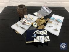 A box of WWII military badges and buttons together with a quantity of aeroplane badges