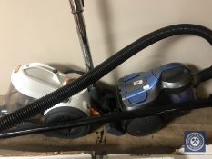 A vax cylinder vacuum together with one other