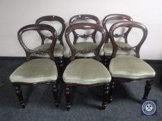 A set of six Victorian mahogany balloon back dining chairs
