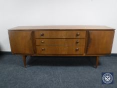A mid twentieth century teak sideboard CONDITION REPORT: Height 77cm, length 184cm,