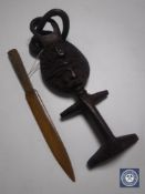 An Ashanti tribal fertility carving together with a carved wooden letter opener
