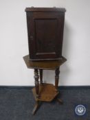 A 20th century hexagonal two-tier occasional table together with a wall cabinet