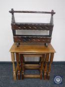A nest of three oak tables together with a rustic pine magazine rack