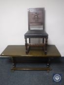 A carved oak panel back dining chair together with an oak refectory coffee table