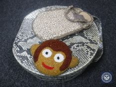 A faux snakeskin vanity case,