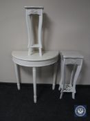 A white D-shaped hall table together with a pair of graduated plant stands
