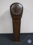 An oak granddaughter clock
