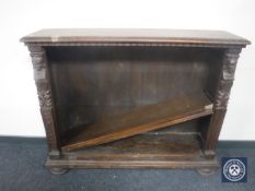 A set of continental oak open bookshelves on bun feet