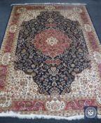 A blue Keshan carpet on blue ground,