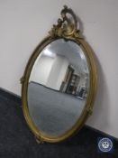 A rococo style gilt framed mirror