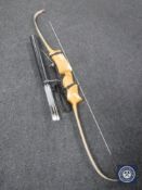 An archery bow and a quiver of arrows