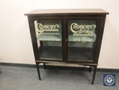 An Edwardian and later inlaid mahogany display cabinet with 