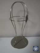 An Ugg metal hat stand