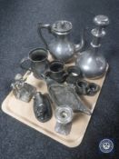 A tray containing metal figure of a lioness, metal figure of a cherub,