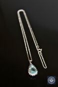 A 14ct white gold aquamarine and diamond pendant, the pear-cut aquamarine weighing 3.