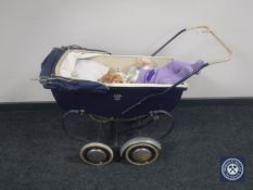 A mid 20th century coach built dolls pram with doll