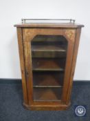 A Victorian inlaid mahogany music cabinet