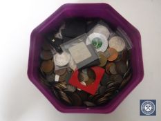 A tub containing pre-decimal British coins,