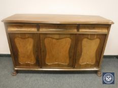 A continental mahogany triple door sideboard,