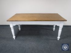 A pine farmhouse kitchen table on painted base