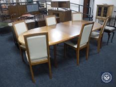A Skovby teak extending dining table (total length 225cm) together with six chairs