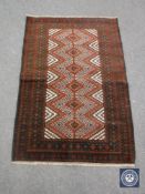 An old baluchi rug 128 cm x 88 cm