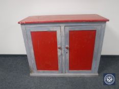 A Victorian pine painted cupboard