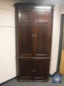 A Georgian mahogany corner cabinet,