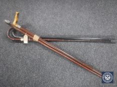 A bundle of four walking sticks,