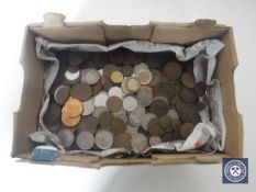 A box containing pre-decimal British and foreign coins