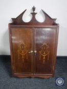 An inlaid mahogany double door wall cabinet