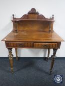 A continental walnut writing desk fitted two drawers (leg damaged)