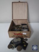 A wooden tea box containing pre-decimal British and foreign coins