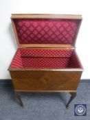 A mahogany sewing box on Queen Anne style legs