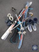A ski bag together with three sets of skis,